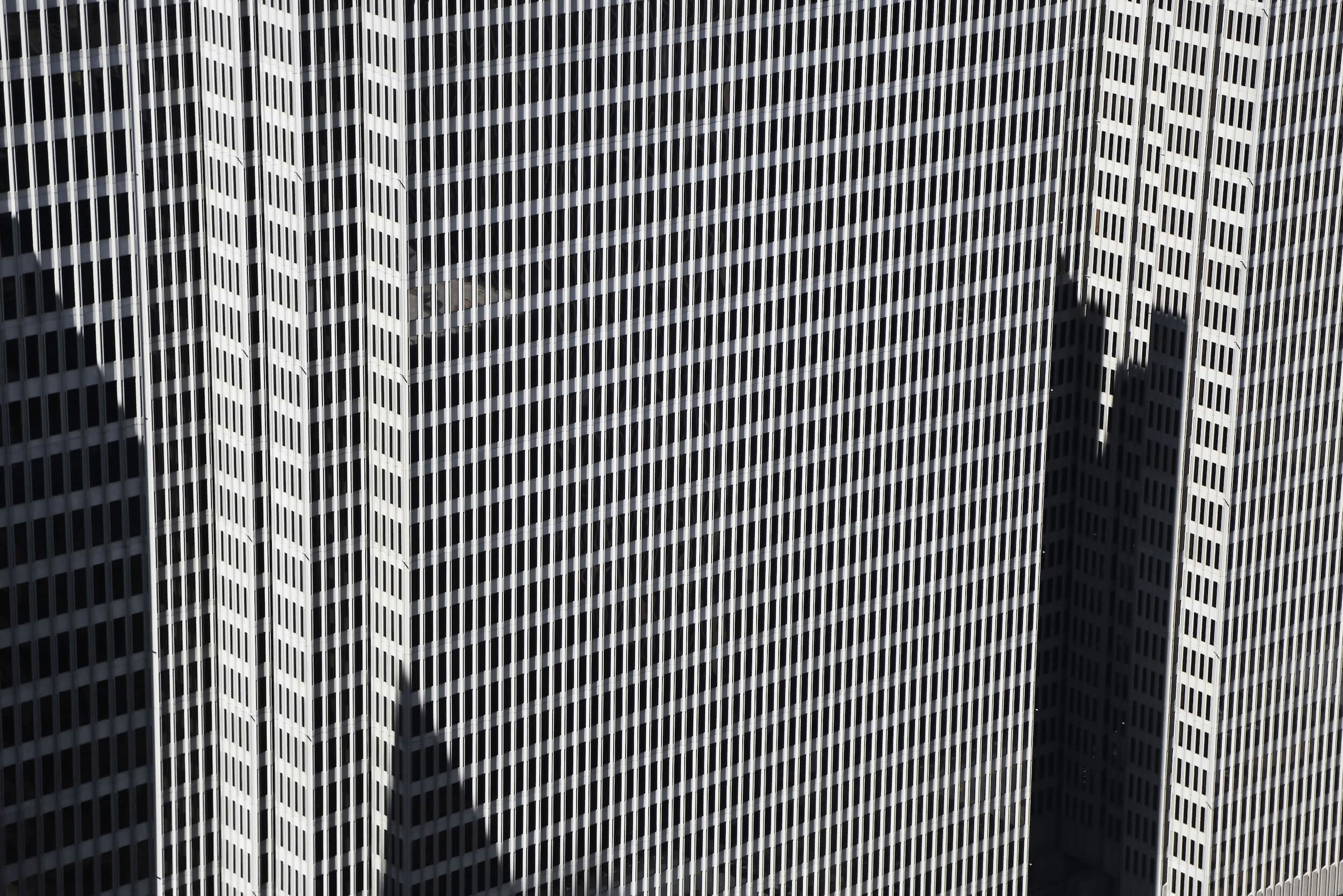 The geometric facade of a San Francisco office tower in black and white